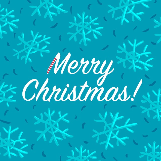 Merry Christmas typographic greeting with a pattern of snowflakes in white, blue and red