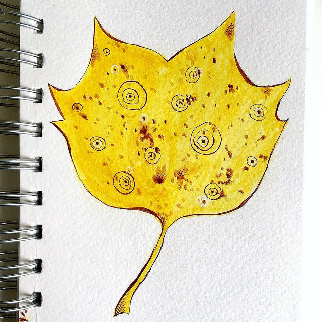 Drawing of a fancy yellow leaf with abstract circle elements