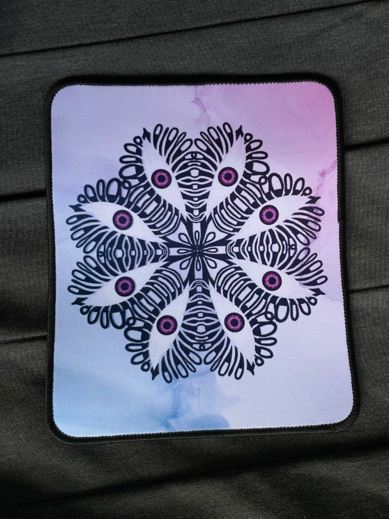 weird mousepad with a mandala of intertwined eyes. Designed by Boriana Giormova, Sofia, Bulgaria. Printed by Threadless