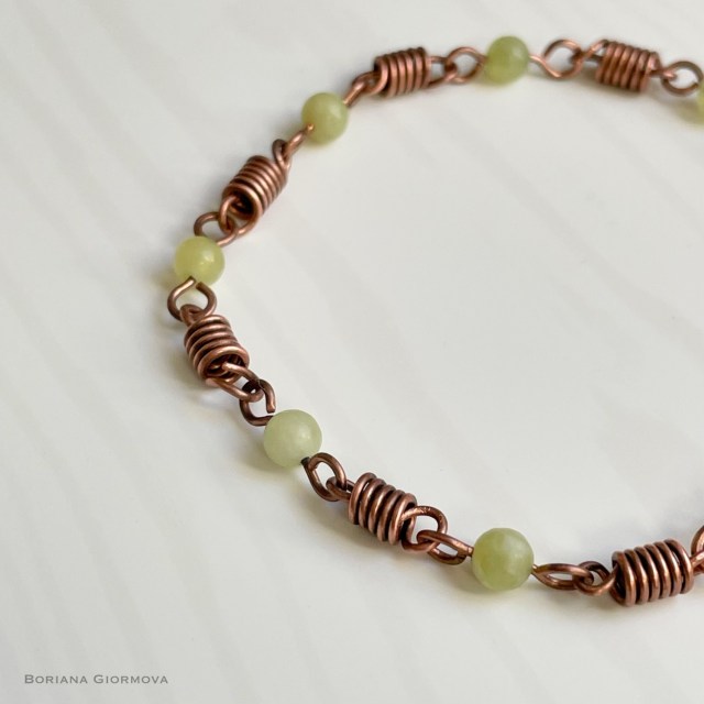 Oxidized copper wire bracelet with copper coils and 4 mm jadeite beads