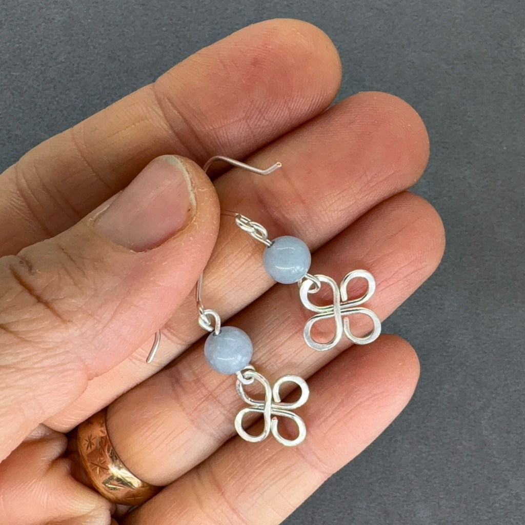 earrings held in hand