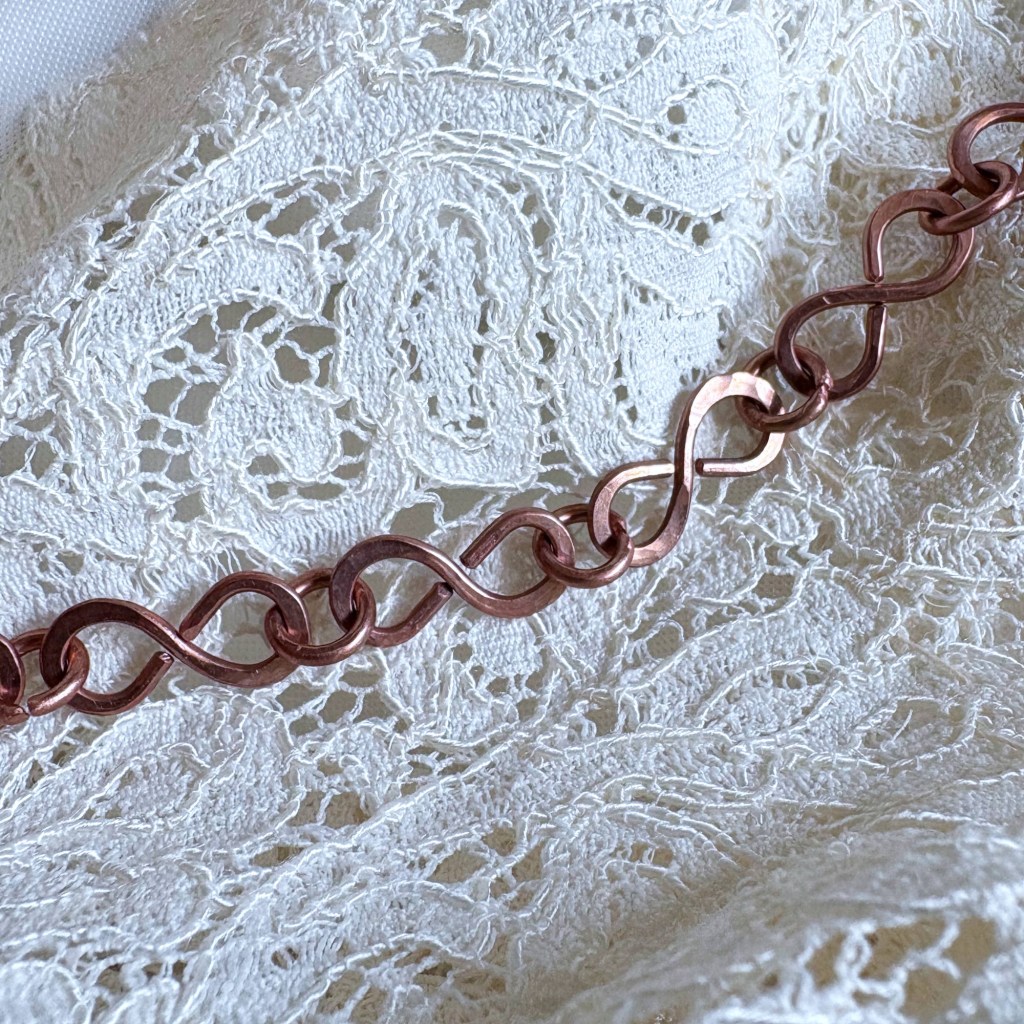 Chain links close-up on lace