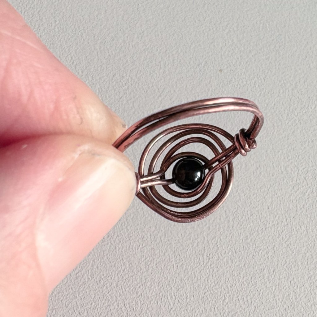 ring back, held in hand