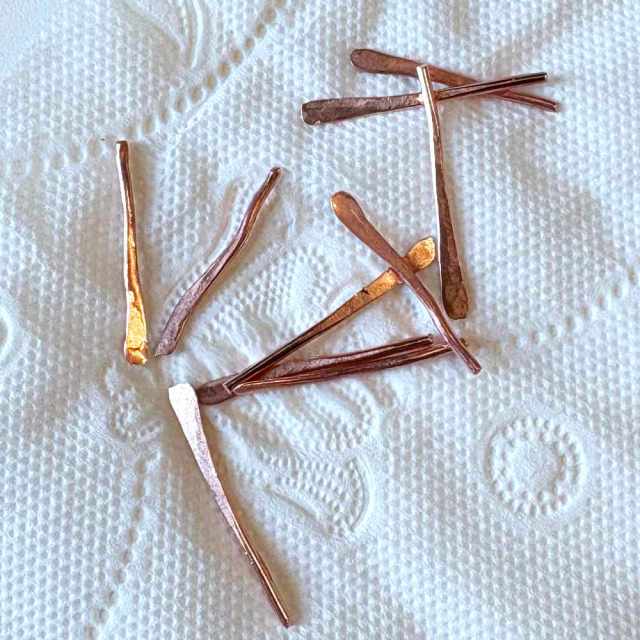 hammered teardrop shaped copper elements in making