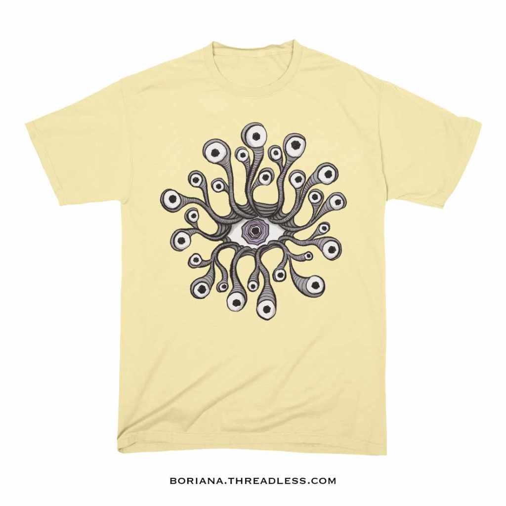 light yellow t-shirt with a weird eye artwork